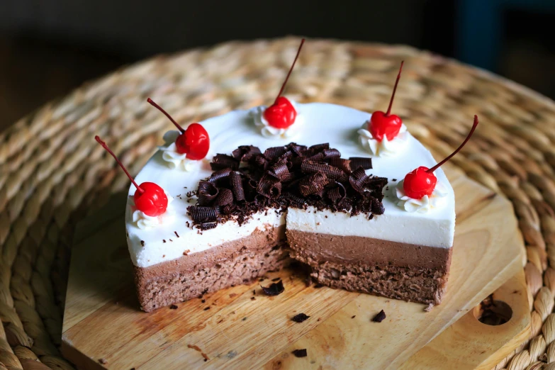 a piece of cake sitting on top of a wooden cutting board, by Julia Pishtar, unsplash, black forest, 王琛, fan favorite, chiffon