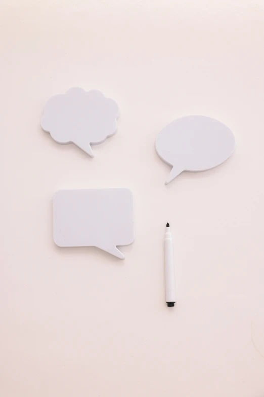 a group of speech bubbles sitting on top of a white surface, wall art, medium - shot, product shot, white plastic