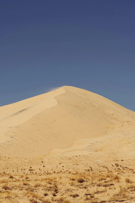 a large sand dune in the middle of a desert, les nabis, sweaty mountain, intimidating floating sand