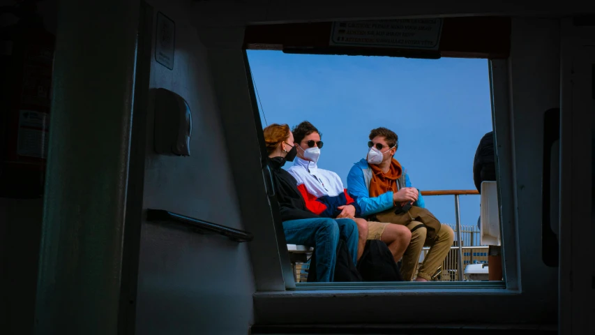 a group of people sitting next to each other on a boat, a portrait, by Eglon van der Neer, pexels, wearing facemask, rhode island, looking out, slide show