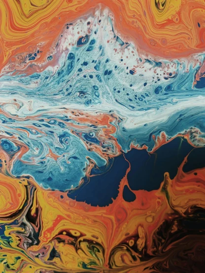 a close up of a painting on a wall, trending on unsplash, abstract art, swirling liquids, some orange and blue, ocean floor, reddit post
