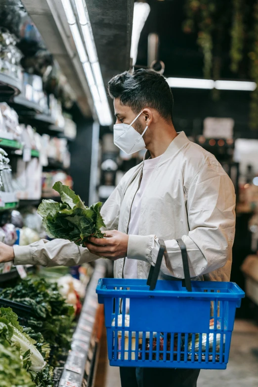 a man wearing a face mask while shopping in a grocery store, pexels, renaissance, lettuce, man with a blue heart, australian, herbs