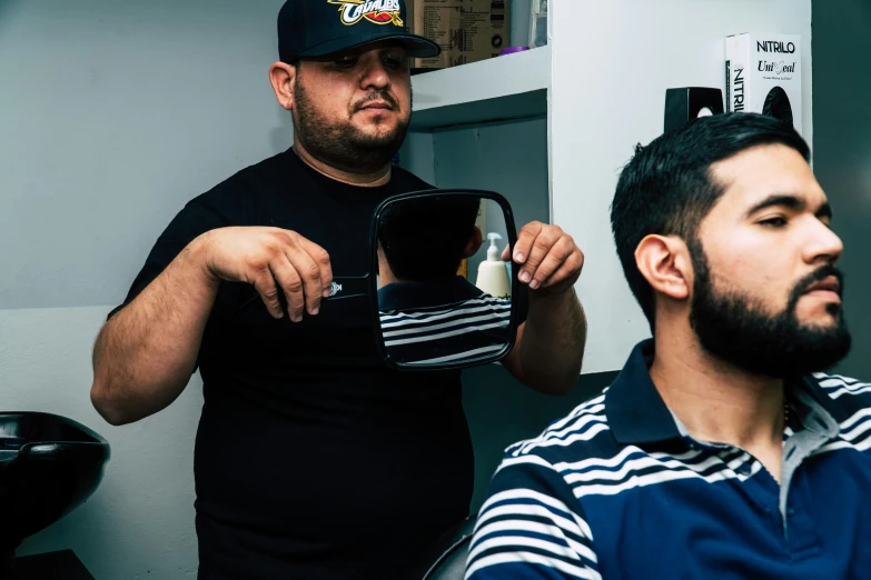 a man getting his hair cut at a barber shop, a photo, by Alejandro Obregón, action bronson, 8k octan photo, 2 0 0 0's photo, fan favorite