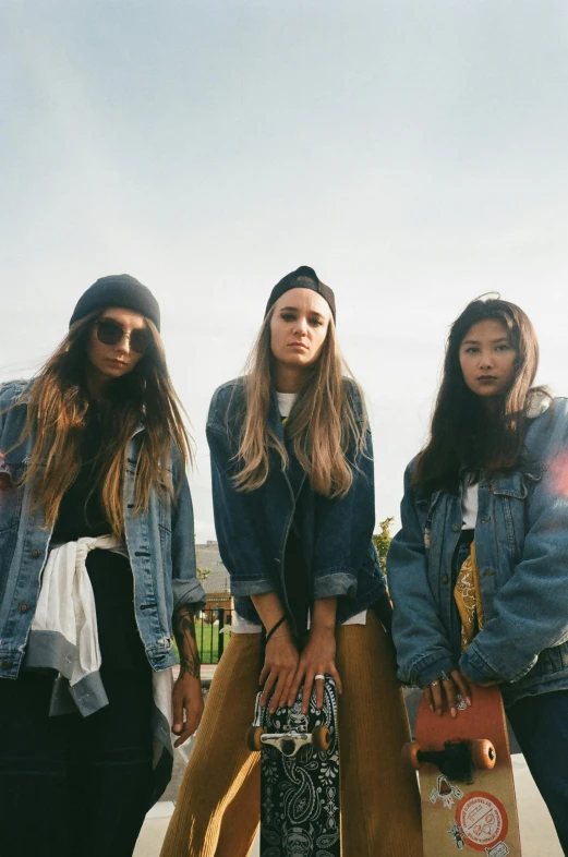 a group of young women standing next to each other, an album cover, unsplash, denim jacket, wearing beanie, supermodel, gemma chen