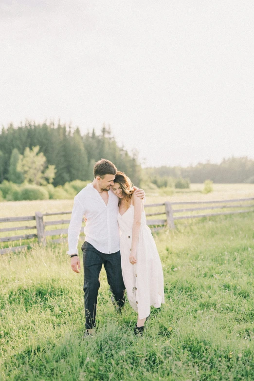 a man and woman standing next to each other in a field, a picture, by Nicolette Macnamara, unsplash, romantic greenery, white hue, rustic setting, yeg