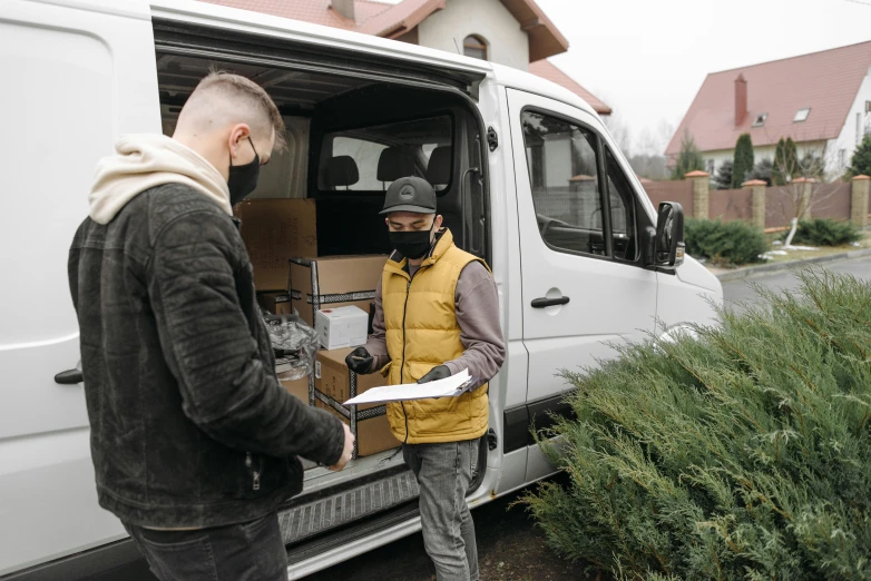 a couple of men standing next to a van, pexels contest winner, scanning items with smartphone, profile image, thumbnail, jovana rikalo