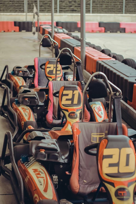 a row of go karting go karting go karting go karting go karting go karting go karting go karting go, a digital rendering, by Tom Bonson, trending on unsplash, 2 5 6 x 2 5 6 pixels, grey orange, f 1.4 kodak portra, nice face