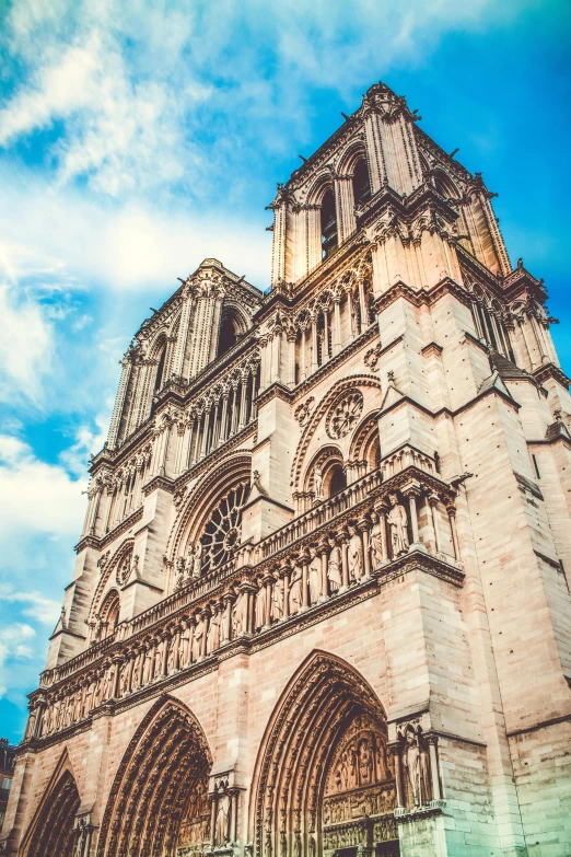 a very tall cathedral with a blue sky in the background, an album cover, unsplash, romanesque, paris, brown, square, nadar