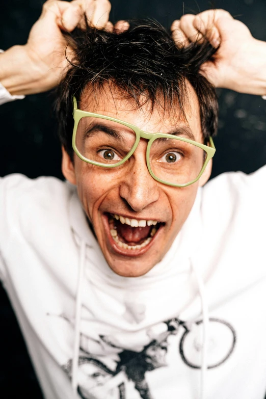 a close up of a person with glasses on, an album cover, inspired by Ivan Mrkvička, trending on reddit, antipodeans, comedian is funny, press shot, head bent back in laughter, marco lense