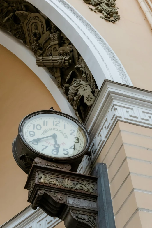 a clock mounted to the side of a building, inspired by Vasily Surikov, high arched ceiling, 2019 trending photo, brown, small details