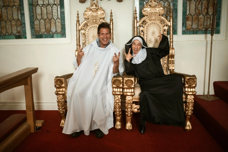 a man and a woman sitting on a golden throne, unsplash, international gothic, little boy wearing nun outfit, both laughing, doing a sassy pose, 15081959 21121991 01012000 4k