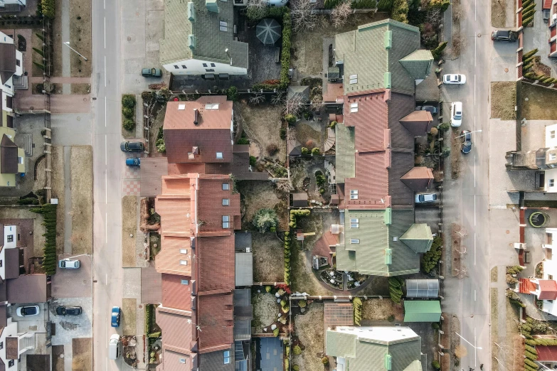 a bird's eye view of a residential neighborhood, by Ejnar Nielsen, unsplash, photorealism, highly detailed textured 8k, top down perspecrive, rundown buildings, highly realistic unreal engine