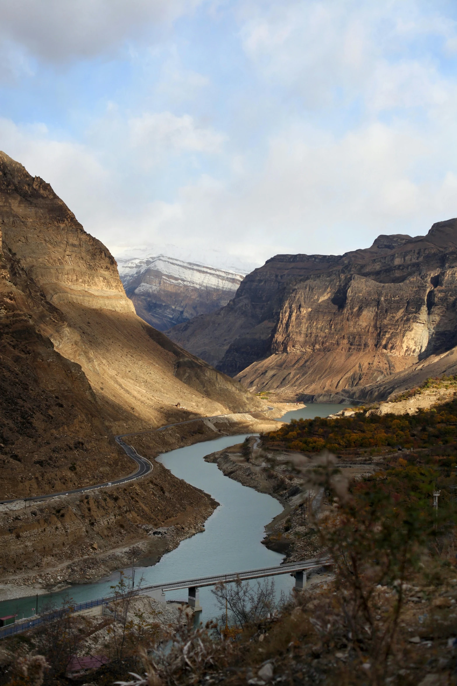 a river running through a valley next to a mountain, canyons, in chuquicamata, banff national park, slate