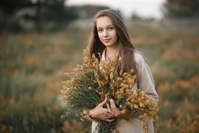 a woman holding a bunch of flowers in a field, a picture, by Attila Meszlenyi, pexels contest winner, portrait of teen girl, 15081959 21121991 01012000 4k, brown, petite