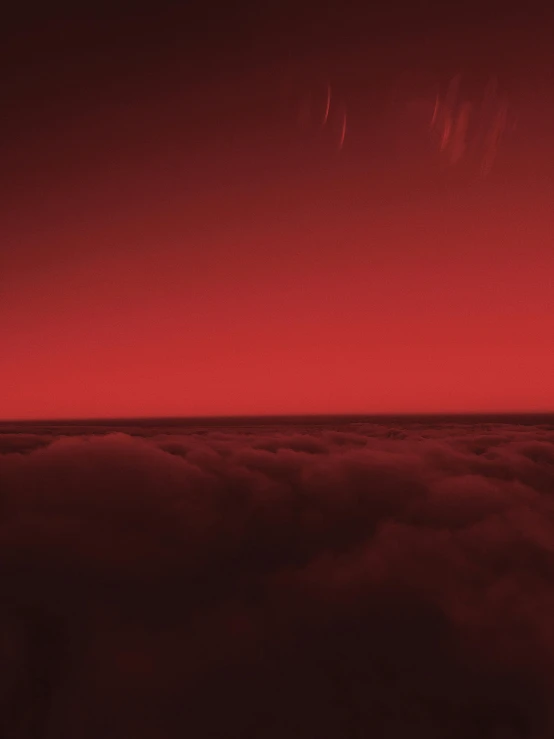 an airplane flying above the clouds at night, an album cover, inspired by Arkhip Kuindzhi, romanticism, red liquid, red haze, morning hour on jupiter, red monochrome