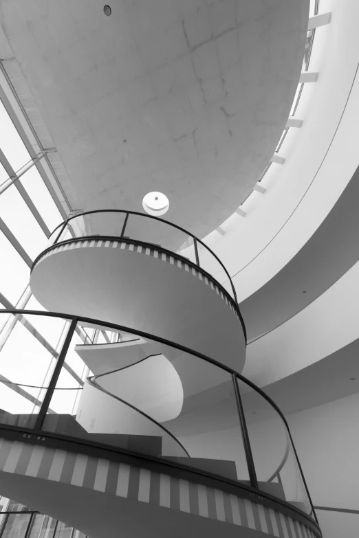 a black and white photo of a spiral staircase, by Bauhaus, light and space, alvar aalto, in the museum, ✨🕌🌙, photo taken in 2018