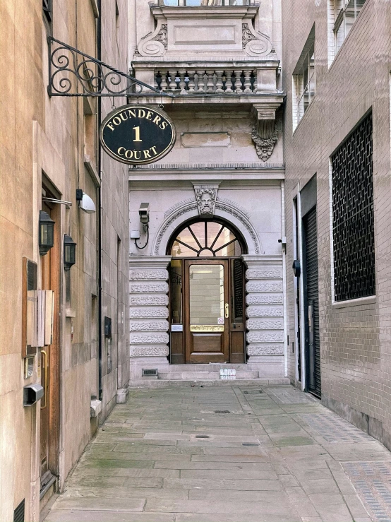 a building with a sign hanging off the side of it, by Christopher Wren, many doorways, thumbnail, court images, tiffany dover