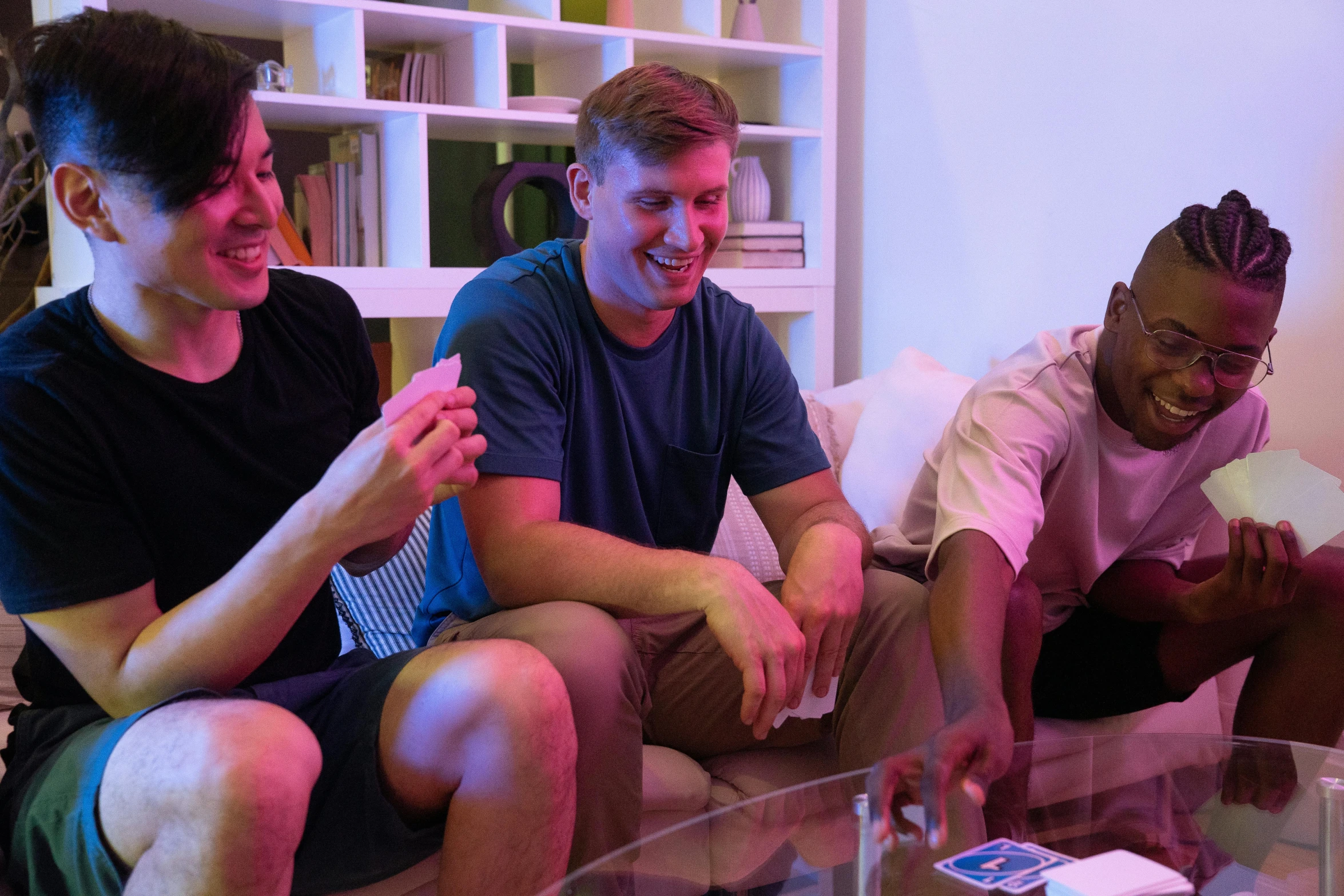 a group of people sitting on top of a couch, card game, bisexual lighting, mkbhd, soccer players timo werner