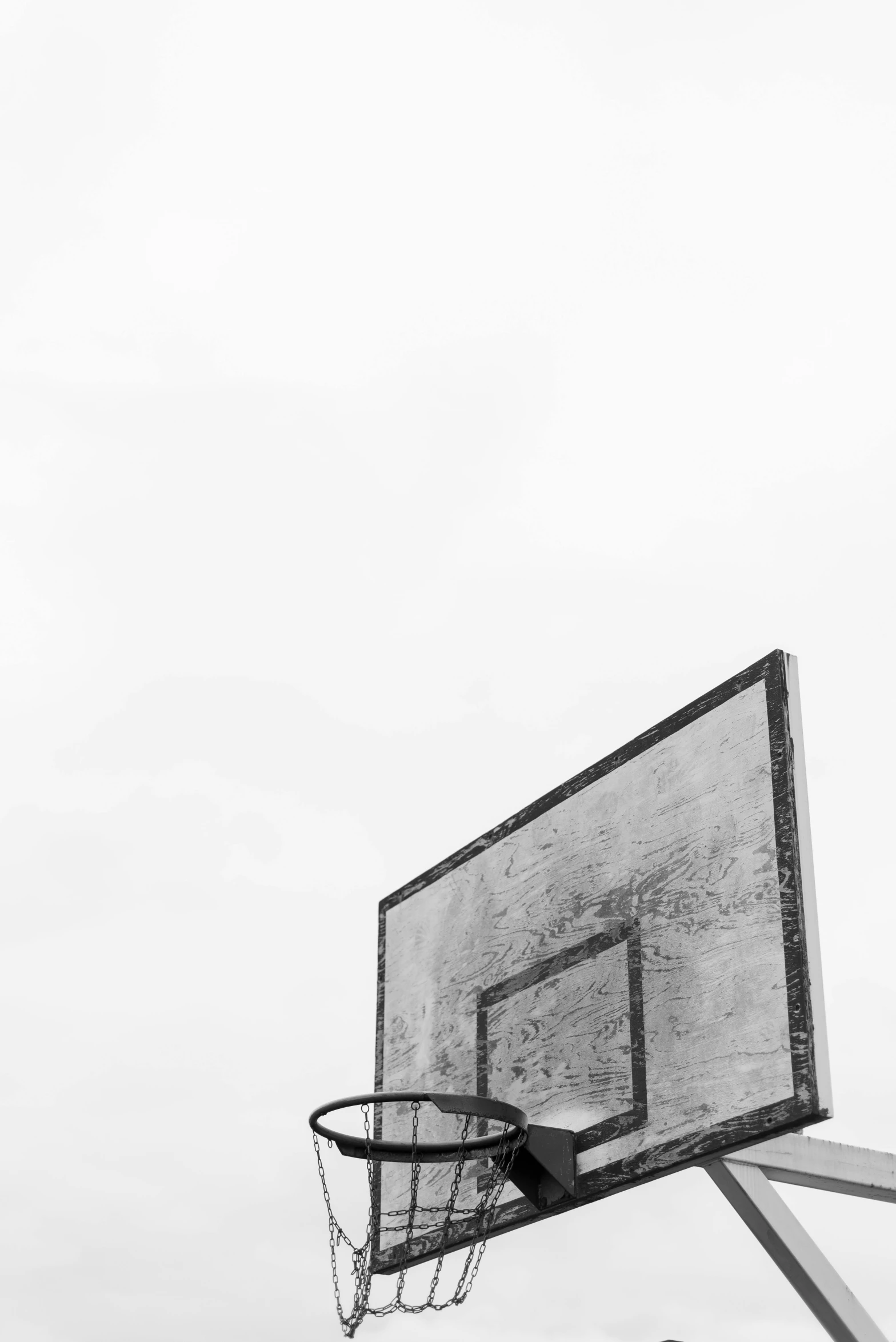 a black and white photo of a basketball hoop, a black and white photo, unsplash, ffffound, white background, game ready, ansel ]