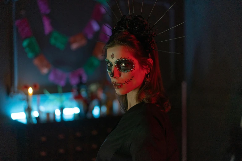 a woman dressed as a skeleton in a dark room, inspired by Elsa Bleda, pexels, beautiful mexican woman, isabela moner, head piece, still from a music video