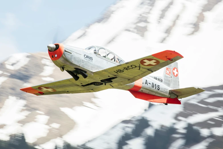 a plane flying in the sky with mountains in the background, a portrait, by Karl Stauffer-Bern, hurufiyya, profile image, festivals, highlight, military