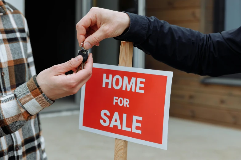 a person holding a car key in front of a home for sale sign, unsplash, hurufiyya, square, low quality photo, thumbnail, argos