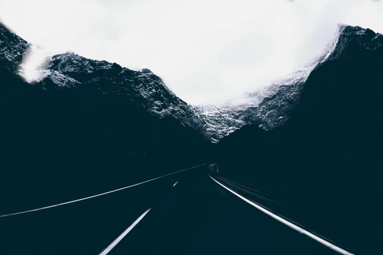 a black and white photo of a train track, an album cover, pexels contest winner, postminimalism, norway mountains, car on highway, cold hues, snapchat photo