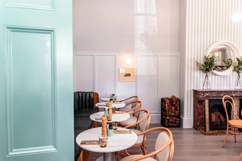a dining room filled with lots of tables and chairs, inspired by Richmond Barthé, trending on unsplash, private press, white marble walls, teal and pink, closed limbo room, smooth panelling