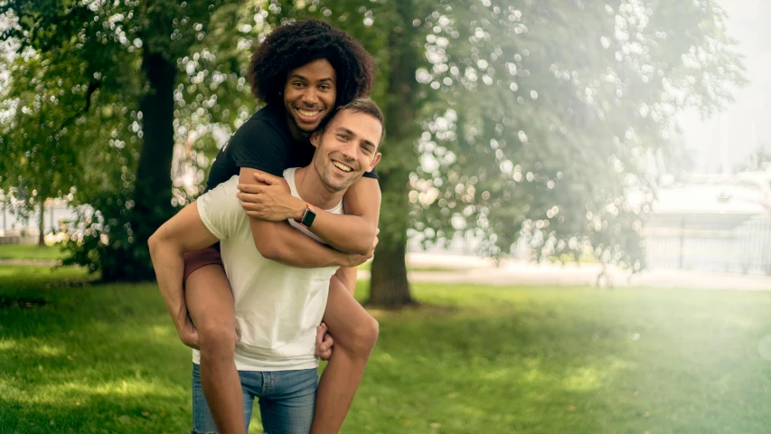 a man carrying a woman on his back in a park, pexels contest winner, mix of ethnicities and genders, 15081959 21121991 01012000 4k, a handsome, caucasian