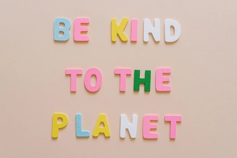 a sign that says be kind to the planet, trending on pexels, pastel colorful mold, avatar image, mini planets, recycled