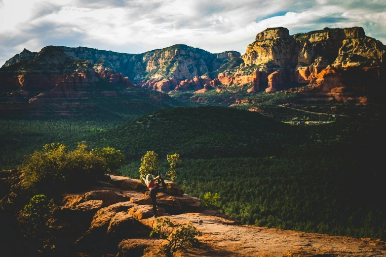 a couple of people sitting on top of a mountain, a photo, pexels contest winner, renaissance, sedona's cathedral rock bluff, lush surroundings, outworldly colours, desktop wallpaper