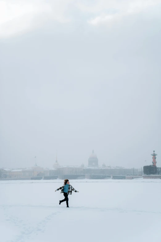 a person flying a kite on top of a snow covered field, saint petersburg, she is walking on a river, low visibility, alex kanevsky