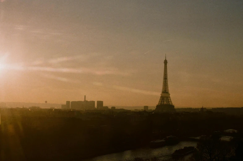 the sun is setting behind the eiffel tower, pexels contest winner, tonalism, denis villeneuve movie still, brown, view, shot on hasselblad