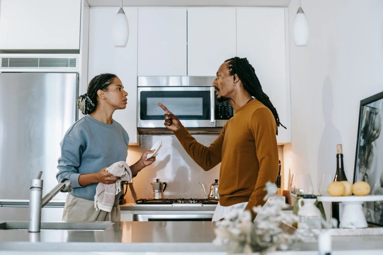 a couple of women standing next to each other in a kitchen, pexels contest winner, happening, arguing, avatar image, men and women, profile image