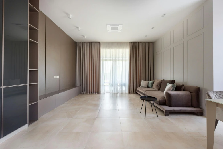 a living room filled with furniture and a sliding glass door, inspired by David Chipperfield, trending on unsplash, light and space, tiles curtains, sandy beige, smooth solid concrete, drapery