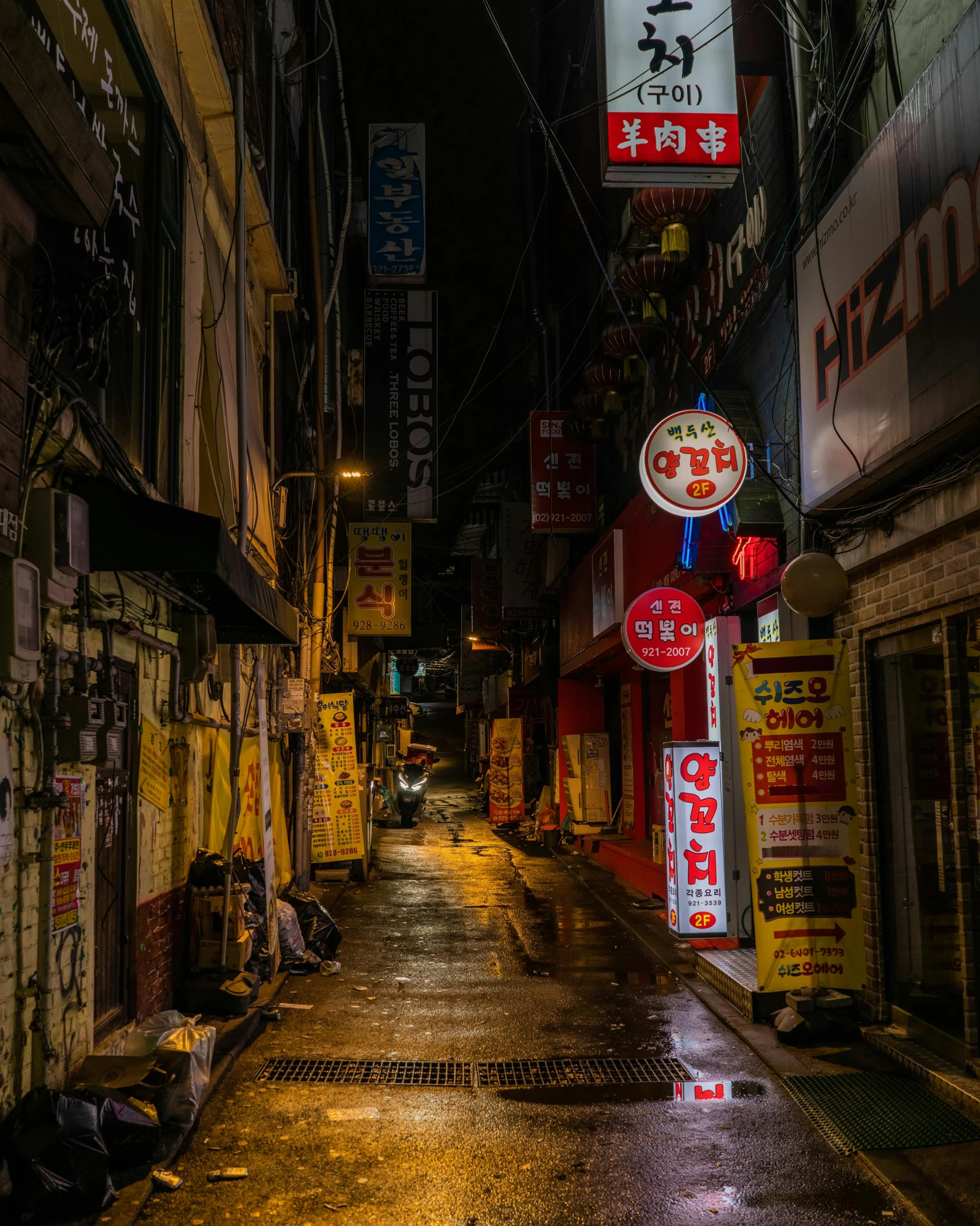 a wet street in an asian city at night, by Jang Seung-eop, unsplash contest winner, graffiti, 2 0 2 2 photo, colorful signs, old city, an escape room in a small