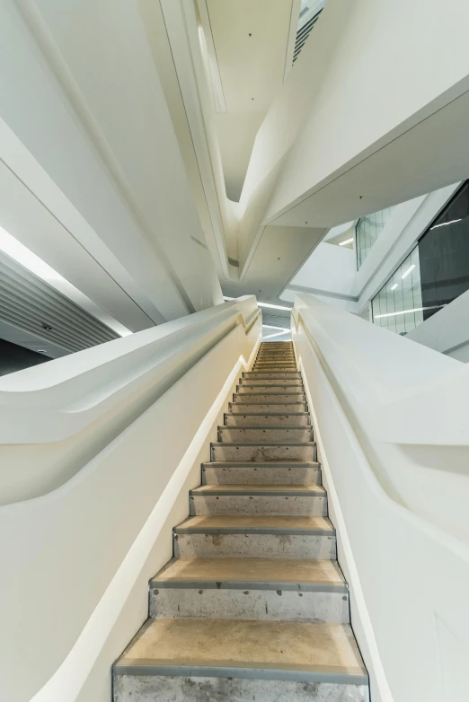 a set of stairs going up the side of a building, inspired by Zaha Hadid, interior of a star destroyer, atrium, fzd school of design, research complex