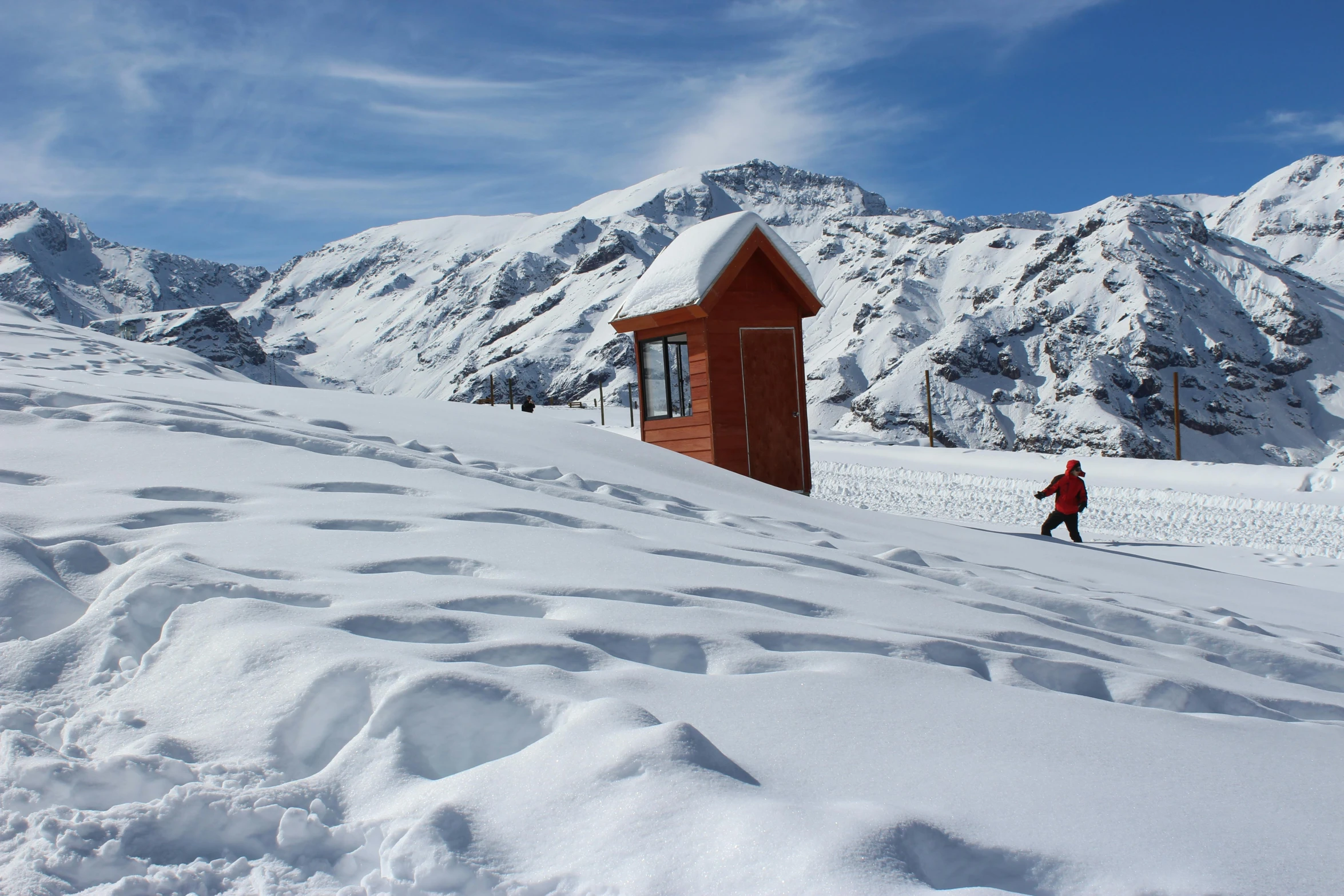 a man riding skis down a snow covered slope, inspired by Peter Zumthor, tiny house, tourist photo, 3 doors, thumbnail