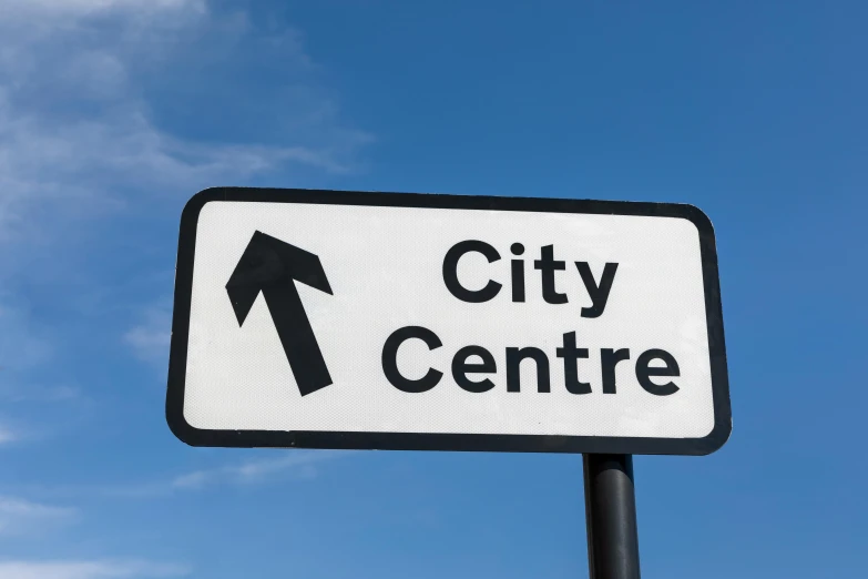 a close up of a street sign with a sky background, by Dan Content, shutterstock, coventry city centre, center model buildings, square, center straight composition