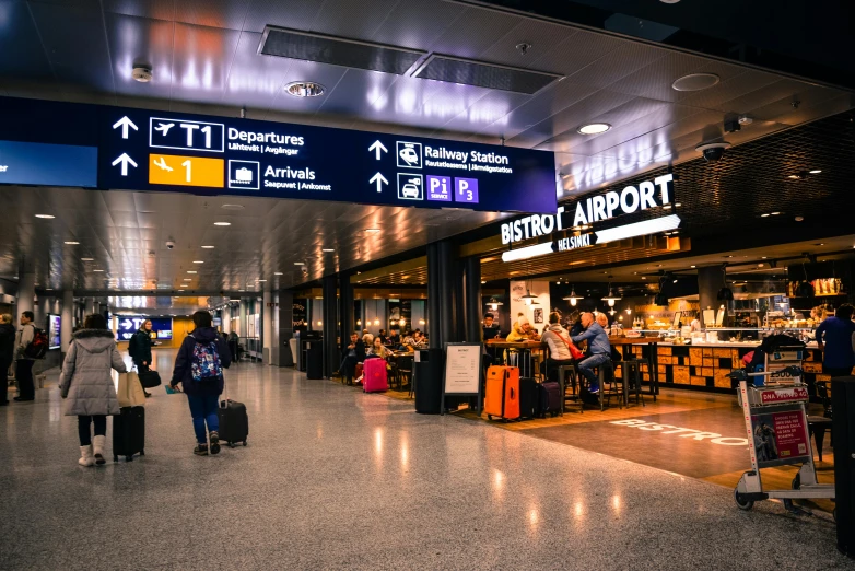 a group of people walking through an airport, by Julia Pishtar, pexels contest winner, signboards, thumbnail, terminal, where a large