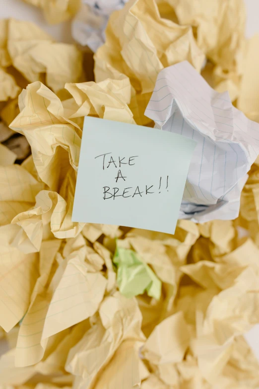 a piece of paper with a note attached to it, by Bertram Brooker, happening, take cover, breaking, tan, stress