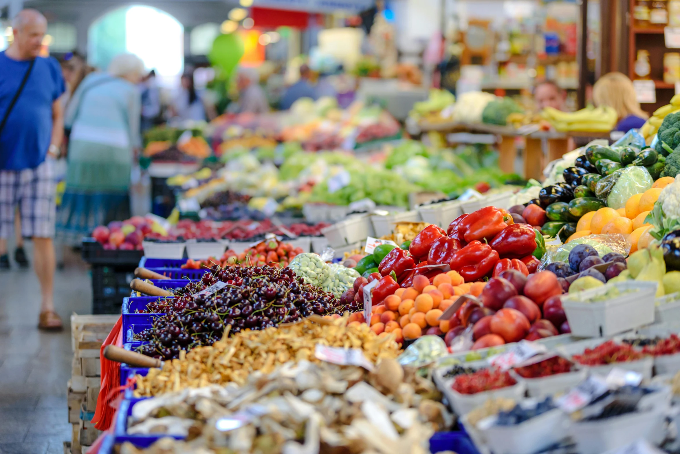 a market filled with lots of different types of fruits and vegetables, by Meredith Dillman, pexels, 2 5 6 x 2 5 6 pixels, blue, long, blurred background