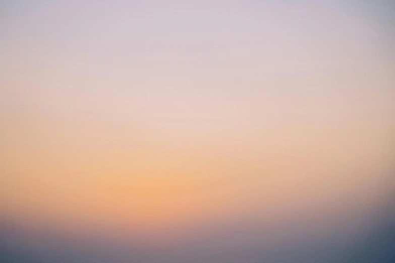 a plane flying over the ocean at sunset, inspired by Attila Meszlenyi, color field, pale pastel colours, out of focus, minimalist photorealist, orange mist