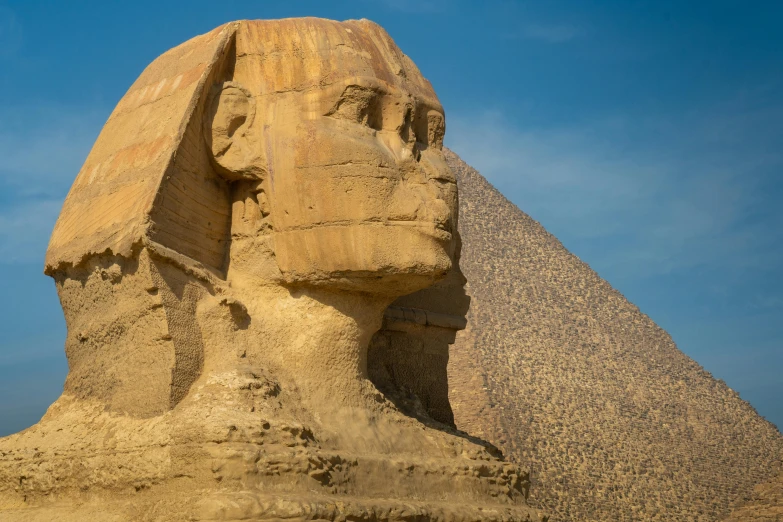a statue of a sphinx in front of a pyramid, by Daniel Lieske, pexels contest winner, avatar image, sandstone, brown, slide show