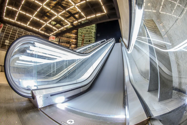 a close up of an escalator in a building, at night, gopro photo, ultrawide image, thumbnail