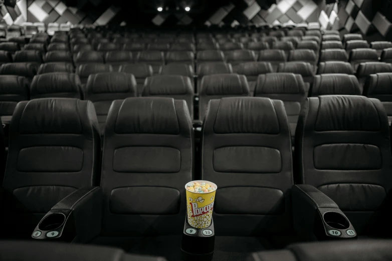 a can of soda sitting in the middle of a movie theater, a picture, 2019 trending photo, cinematic luts, instagram picture, cinematic. by leng jun