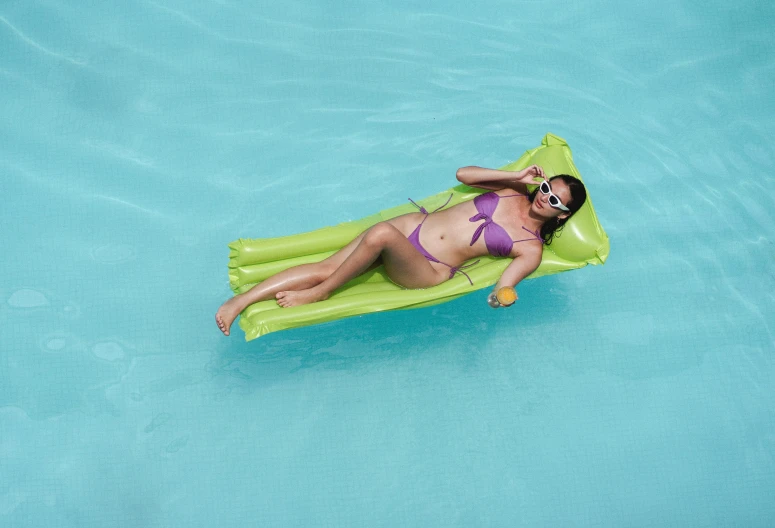 a woman in a bikini laying on an inflatable raft, by Nicolette Macnamara, light green, 3 meters, square, lightweight