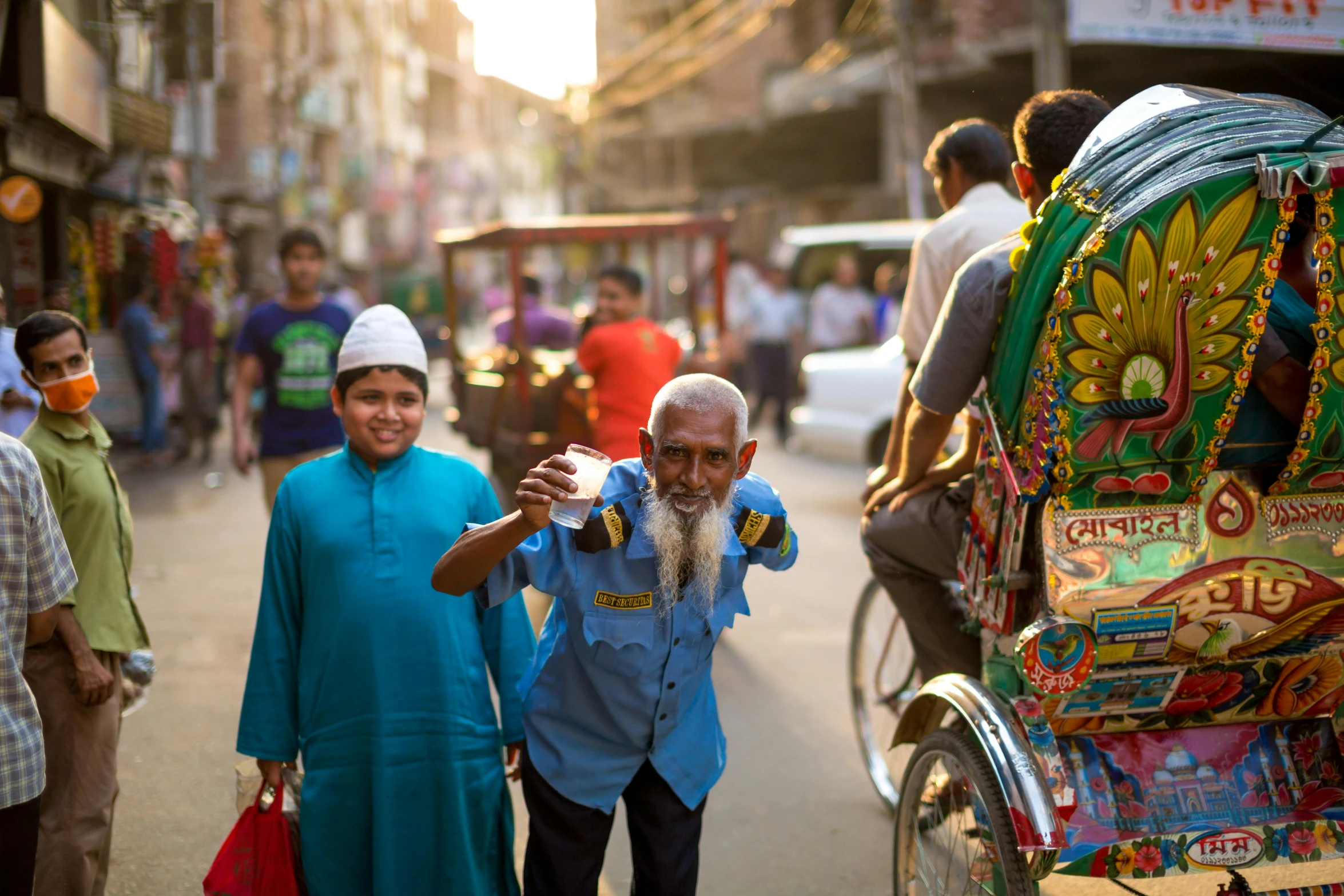 a group of people walking down a street, pexels contest winner, hurufiyya, old dhaka, thumbnail, mogul khan, on a sunny day