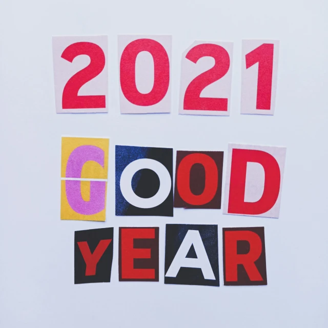 a close up of a piece of paper with the words 2021 on it, a photo, trending on pexels, graffiti, feeling good, barbara kruger, good smile company anime style, paper cut out collage artwork