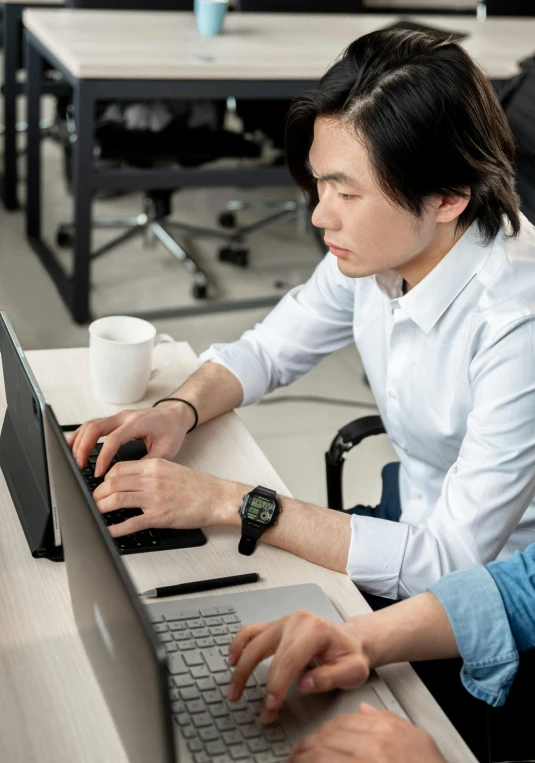 a couple of people sitting at a table with laptops, a computer rendering, by Adam Marczyński, trending on unsplash, asian male, holding arms on holsters, testing custom, sitting in office